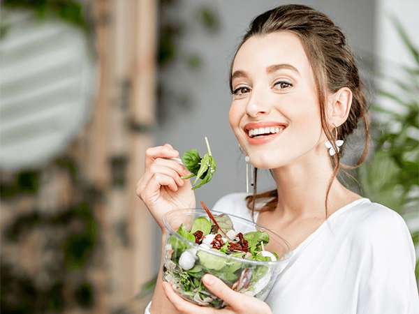 Well Woman Health Check and Women eating the salad